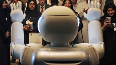 A humanoid robot designed and developed by Honda and named Asimo waves for the audience at the end of the company's presentation during the last day of the Government Summit in Dubai, United Arab Emirates, Wednesday, Feb. 11, 2015. (AP)