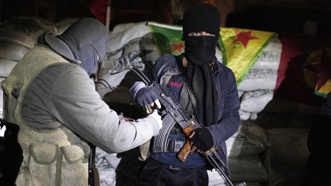 The militants of the Kurdistan Workers' Party, or PKK, stand at a barricade in Sirnak, Turkey, late Wednesday, Dec. 23, 2015. Security forces have killed 183 Kurdish rebels in a week in southeast Turkey, news agencies reported. The government imposed curfews in the mainly Kurdish towns of Cizre, Silopi, Nusaybin and Sur district of Diyarbakir as the security forces battle militants linked to the PKK who have moved their fight for autonomy to some towns and city neighborhoods in southeastern Turkey. (AP Photo/Cagdas Erdogan)