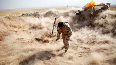 A Kurdish Peshmerga fighter launches mortar shells towards Zummar, controlled by ISIS, near Mosul. (File photo: Reuters)