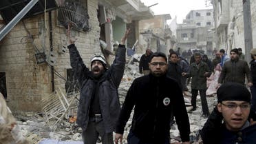 A civil defence member reacts at a site hit by what activists said were three consecutive air strikes carried out by the Russian air force, the last which hit an ambulance, in the rebel-controlled area of Maaret al-Numan town in Idlib province, Syria January 12, 2016. REUTERS/Khalil Ashawi TPX IMAGES OF THE DAY