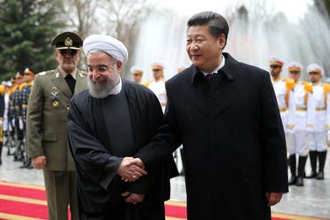 Chinese President Xi Jinping, right, shakes hands with Iranian President Hassan Rouhani in Tehran on Jan. 23, 2016. (AP