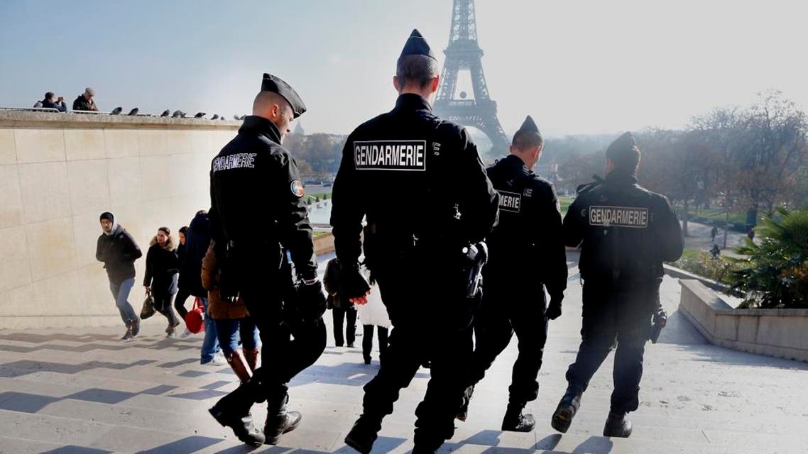 In this Monday, Nov. 23, 2015 file photo, French gendarmes officers patrol near the Eiffel Tower, in Paris. In the aftermath of the horrifying attacks in Paris on Nov. 13, 2015, people were so jittery that some loud, unremarkable noises were enough to send some people scurrying for help. Some experts say it will take months for Europeans to adapt to life after the paris attacks. (AP Photo/Jacques Brinon, File)