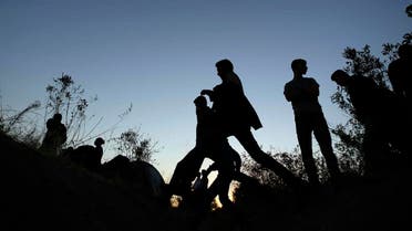 Hundreds of people trying to reach Europe walk towards the Turkish city of Edirne, which borders European Union members Greece and Bulgaria, Tuesday, Sept. 15, 2015. Asylum-seekers are planning a sit-in protest near the border with Greece, hoping authorities would allow them to cross into Europe overland instead of them having to risk their lives by sea trying to reach Greek islands.(AP Photo/Emrah Gurel)