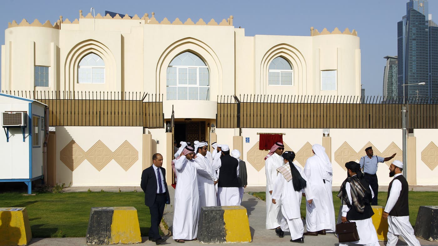 Guests arrive for the opening ceremony of the Taliban political office in Doha on June 18, 2013. (AFP)