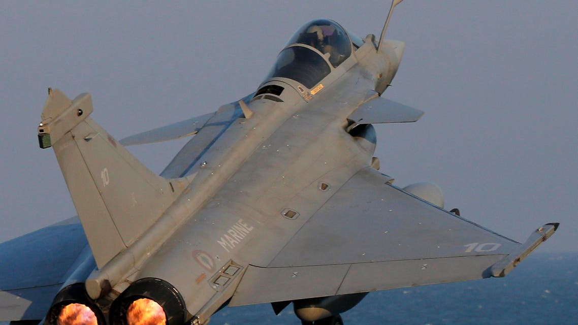  A Rafale fighter jet is catapulted for a mission, on France's flagship Charles de Gaulle aircraft carrier in the Persian Gulf, Wednesday, Jan. 13, 2016. The Charles de Gaulle joined the U.S.- led coalition against Islamic State group in November, as France intensified its airstrikes against extremist sites in Syria and Iraq in response to Islamic State group threats against French targets. (AP Photo/Christophe Ena)