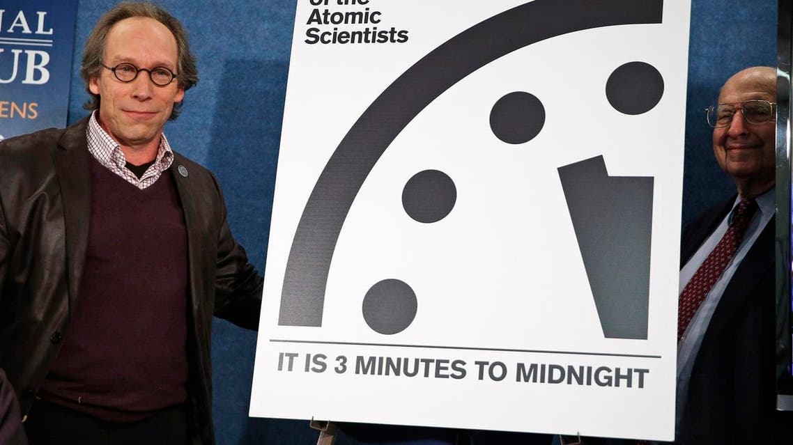 Lawrence Krauss, left, the chair of the Bulletin of Atomic Scientists, and former ambassador Thomas R. Pickering, far right, stand after unveiling the 'Doomsday Clock' that remains at three minutes to midnight. (AP)