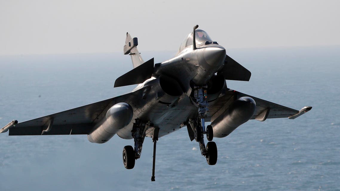 A Rafale fighter jet lands after a mission, on France's flagship Charles de Gaulle aircraft carrier in the Persian Gulf, Wednesday, Jan. 13, 2016. The Charles de Gaulle joined the U.S.- led coalition against Islamic State group in November, as France intensified its airstrikes against extremist sites in Syria and Iraq in response to Islamic State group threats against French targets. (AP Photo/Christophe Ena)