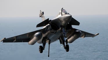  A Rafale fighter jet lands after a mission, on France's flagship Charles de Gaulle aircraft carrier in the Persian Gulf, Wednesday, Jan. 13, 2016. The Charles de Gaulle joined the U.S.- led coalition against Islamic State group in November, as France intensified its airstrikes against extremist sites in Syria and Iraq in response to Islamic State group threats against French targets. (AP Photo/Christophe Ena)