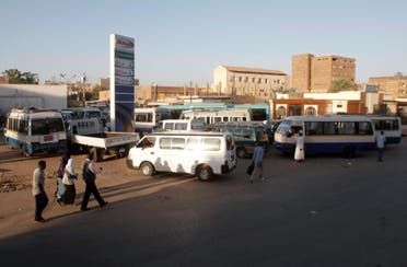 A file photo shows drivers queue up in their vans for fuel at a gas station in the Sudanese capital Khartoum. (AFP)