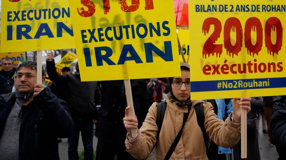 Supporters of Maryam Rajavi, President of the National Council of Resistance of Iran, demonstrate against the Iranian President Hassan Rowhani's visit in Paris, Wednesday, Jan. 27, 2016. (AP)