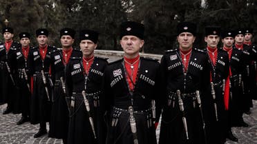 In this Monday, Jan. 11, 2016 photo, Circassian guards pose for a photograph outside Basman Palace, in Amman, Jordan. AP