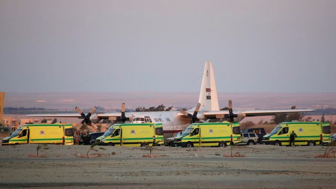 Ambulances line up as emergency workers unload bodies of victims from the crash of a Russian aircraft over the Sinai peninsula at the Kabrit military airport, some 20 miles north of Suez, Egypt, Saturday, Oct. 31, 2015. A Russian Metrojet plane crashed Saturday morning in a mountainous region in the Sinai after taking off from Sharm el-Sheikh, killing all 224 people aboard. Officials said the pilot had reported a technical problem and was looking to make an emergency landing before radio contact with air traffic controllers went dead. (AP Photo/Amr Nabil)