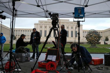 A television crew sets up ahead of the start of Syrian talks in front of the United Nations European headquarters in Geneva. (Reuters)
