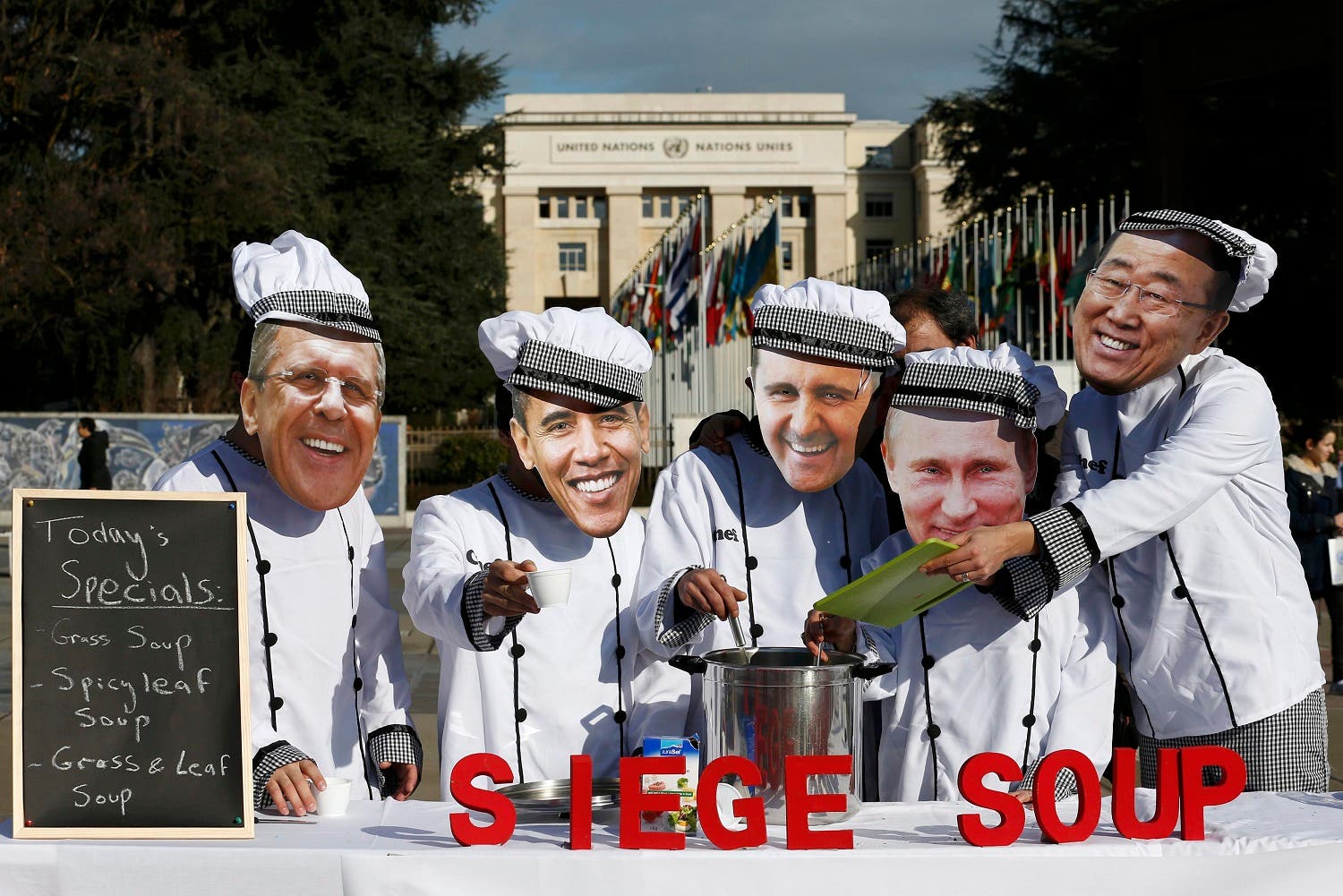 Activists of Planet Syria wearing masks depicting some of the world leaders Lavrov, Obama, al-Assad, Putin and Ban serve a siege soup outside the U.N. in Geneva. (Reuters)