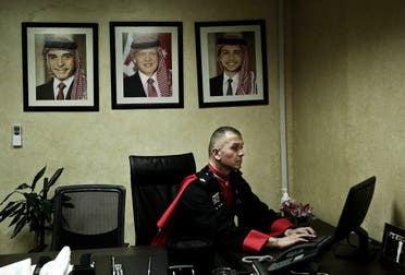 In this Monday, Jan. 11, 2016 photo, 45 year-old Circassian guard leader Major Ayman Abzakh, works at the Circassian Headquarters in Basman Palace, in Amman, Jordan.