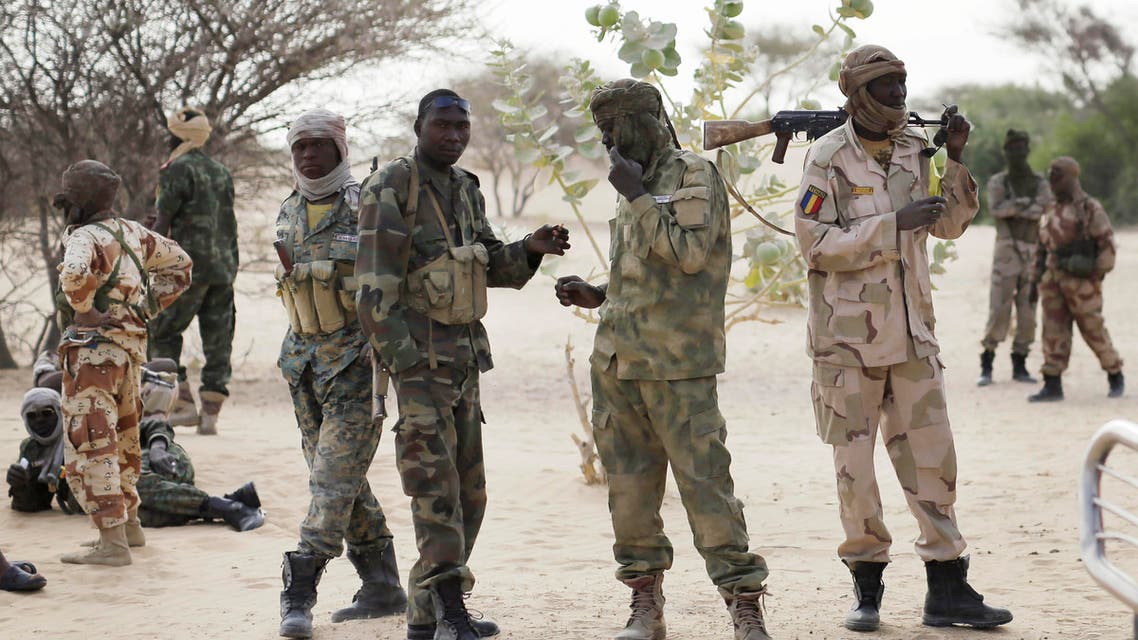 Chadian troops previously stationed by the Sudanese border make a stop on their way to lake Chad near Baga Sola Friday March 6, 2015. Large contingents of Chadian troops were seen heading to the region bordering Nigeria, where residents and an intelligence officer said Boko Haram fighters are massing at their headquarters in the northeast Nigerian town of Gwoza in preparation for a showdown with multinational forces. (AP Photo / Jerome Delay)