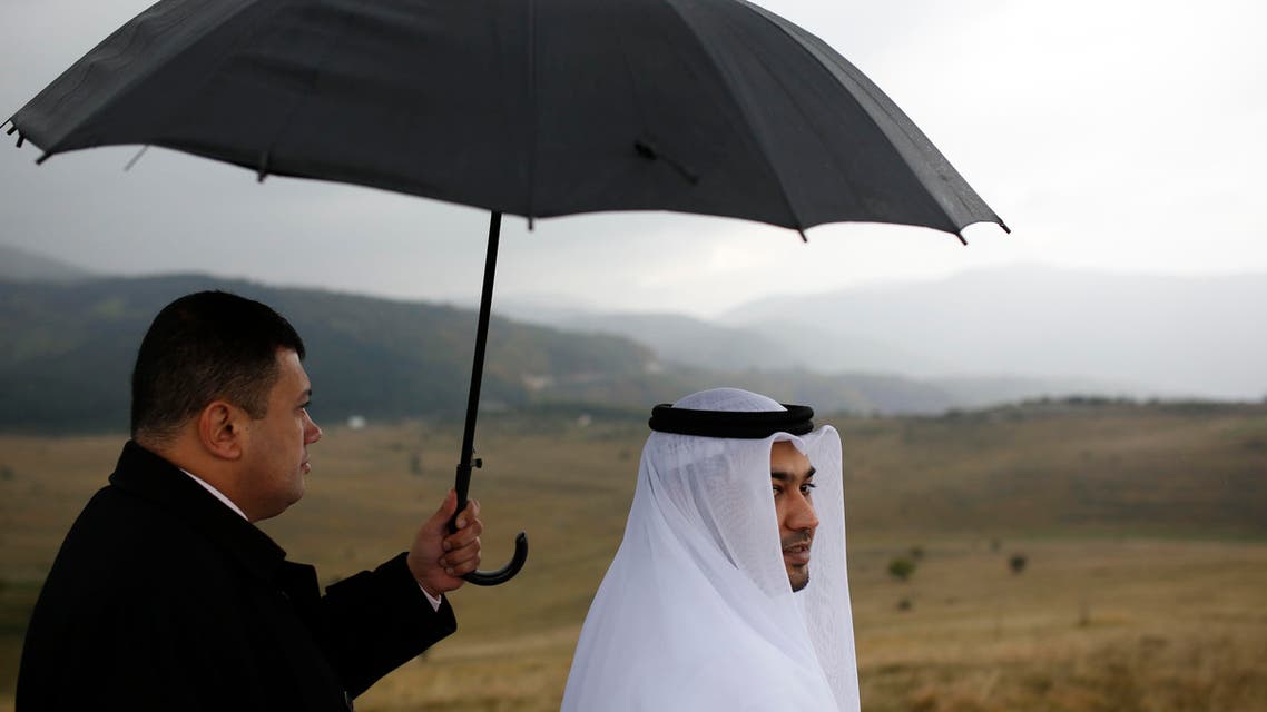  In this photo taken on Wednesday, Oct. 14, 2015 show Ismail Ahmed, right, the head of Buroj Property Development from Dubai looks at the plateau where his company plans to build a euro 2.3 billion ($2.4 billion) town called Buroj Ozone on the Bjelasnica mountain area , less than 15 kilometers southwest of Sarajevo. As tourists from the Persian Gulf countries look to book their next holiday to escape the summer heat, Arab investors are betting on one unusual destination: Bosnia. The mountainous Balkan country, which was devastated by the 1992-95 war, is becoming a popular destination for tourists from the United Arab Emirates, Kuwait and Qatar thanks to its comfortable summer temperatures and local Muslim community. (AP Photo/Amel Emric)
