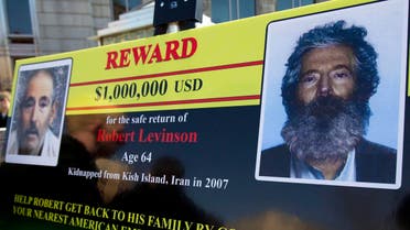 an FBI poster showing a composite image of former FBI agent Robert Levinson, right, of how he would look like after then-five years in captivity. (AP)