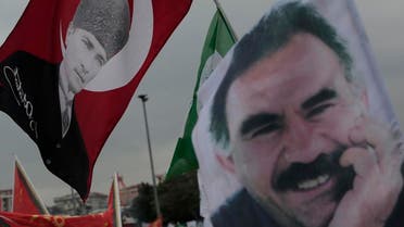 Supporters of the pro-Kurdish Peoples' Democratic Party, (HDP) wave a flag, left, with Turkish Republic founder Mustafa Kemal Ataturk, and another one of imprisoned Kurdish rebel leader Abdullah Ocalan, during a rally in Istanbul, Turkey, Monday, June 8, 2015, a day after the elections. The biggest change from Turkey's previous parliament is the ascendancy of the People's Democratic Party, a socially liberal force rooted in the Kurdish nationalism of Turkey's southeast. It attracted more than 12 percent of votes, breaching the minimum threshold of 10 percent. Turkey's President Recep Tayyip Erdogan's long-ruling Justice and Development Party(AKP), has suffered surprisingly strong losses in parliament that will force it to seek a coalition partner for the next government. (AP Photo/Lefteris Pitarakis)