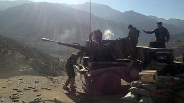 In this Sunday, Dec. 28, 2014 photo, Afghan National Army soldiers open fire into mountains during an ongoing war, in the Dangam district of Kunar province, Afghanistan.  AP