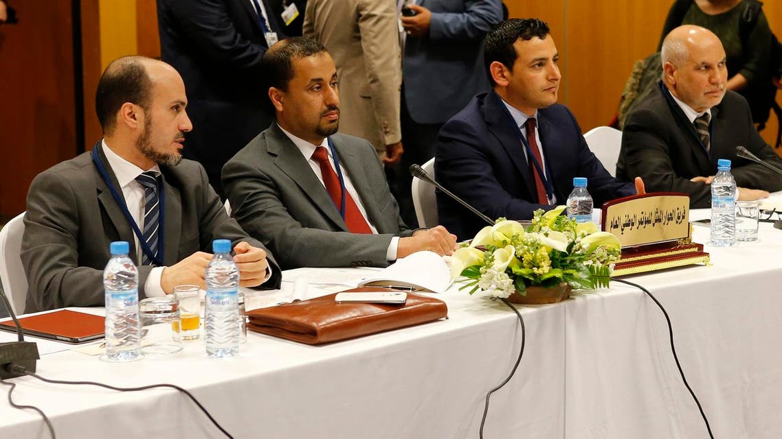 Dr. Saleh Almkhozom, Second Deputy Chairman of the General National Congress, 2nd left and Omar Hmeidan, spokesman for the GNC, 2nd right and members from the General National Congress legally-installed government in the capital, Tripoli, pose for photographers before the talks with UN Special Envoy to Libya Bernardino Leon at the Palais des Congres of Skhirate 30 km south of Rabat, Thursday, March 5, 2015. AP