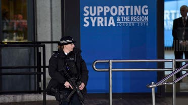 An armed police office stands on duty during a donors conference for Syria at the Queen Elizabeth II Conference Centre in London, Britain February 4, 2016. REUTERS