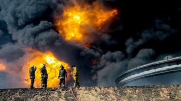 Firefighters try to put out the fire in an oil tank in the port of Es Sider, in Ras Lanuf, Libya. (File photo: Reuters)