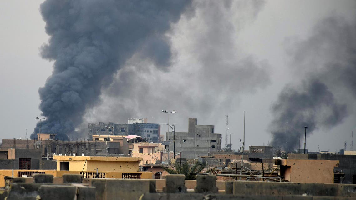 Smoke rises from Islamic State positions following a U.S.-led coalition airstrike as Iraqi Security forces advance their position in downtown Ramadi, 70 miles (115 kilometers) west of Baghdad, Iraq, Thursday, Dec. 24, 2015.