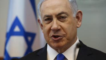 Israeli Prime Minister Benjamin Netanyahu opens the weekly cabinet meeting at his Jerusalem office on Sunday, Feb. 7, 2016. (Gali Tibbon/Pool via AP)