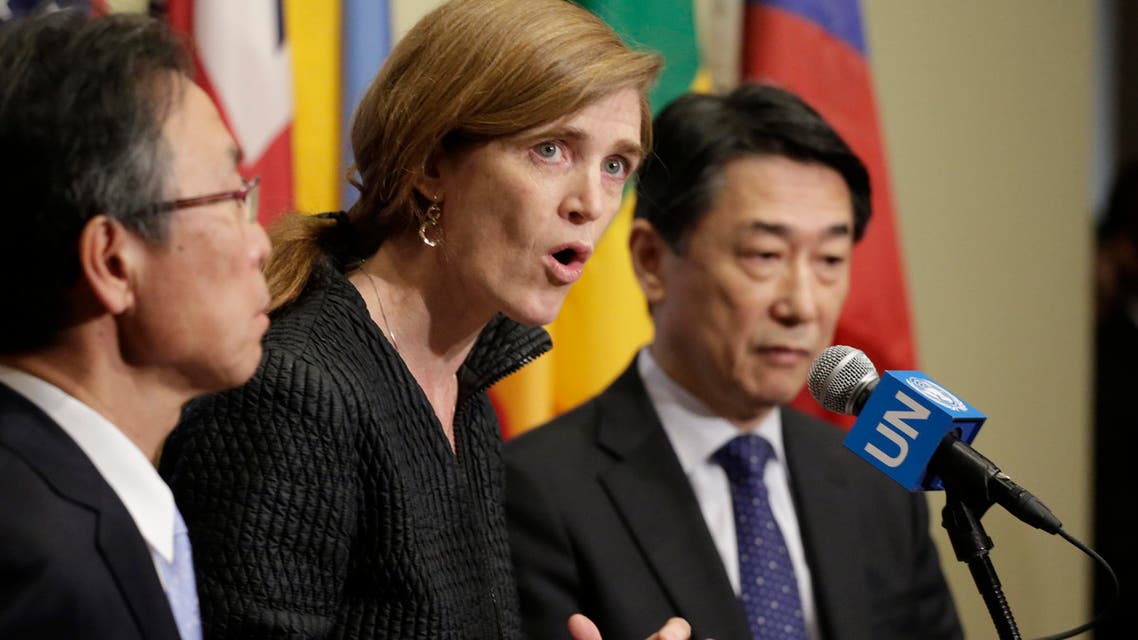 Motohide Yoshikawa, left, Japan's ambassador to the United Nations, and South Korea's Ambassador Oh Joon, right, listen as Samantha Power, center, the U.S. ambassador, makes comments to the media following a Security Council meeting at U.N. headquarters, Sunday, Feb. 7, 2016. AP