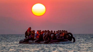 Migrants on a dinghy arrives at the southeastern island of Kos, Greece, after crossing from Turkey, Thursday, Aug. 13, 2015. Greece has become the main gateway to Europe for tens of thousands of refugees and economic migrants, mainly Syrians fleeing war, as fighting in Libya has made the alternative route from north Africa to Italy increasingly dangerous. (AP Photo/Alexander Zemlianichenko, File)