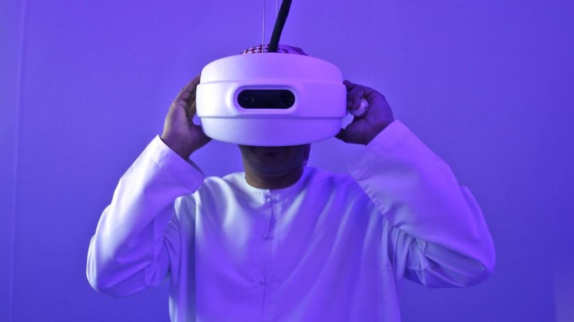 An Emirati man watches through a special viewfinder at the Museum of the future during the opening day of the World Government Summit in Dubai, United Arab Emirates, Monday, Feb. 8, 2016. Those gathered for the World Government Summit in Dubai offered no immediate solutions to the crises gripping the region, like low global oil prices, global warming and the rise of violent extremism. But all acknowledged that keeping government responsive to its citizens remains crucial. (AP Photo/Kamran Jebreili)