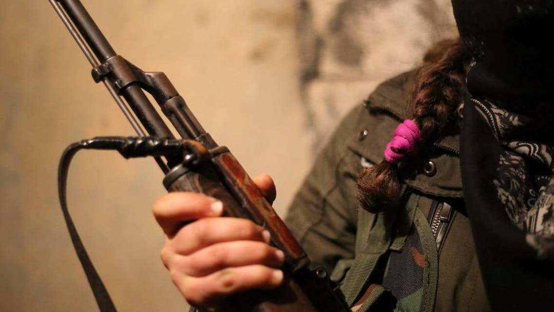 A female Kurdish fighter, poses for photographs as she stands at a makeshift bunker at the mainly-Kurdish town of Idil, Turkey, in Sirnak province that neighbours Iraq, early Wednesday, Jan. 20, 2016. Turkey’s security forces battle Kurdish militants linked to the Kurdistan Workers’ Party, or PKK. Fighting between the PKK and the security forces reignited in July, causing the collapse of a two-year peace process. (AP Photo/Murat Bay)