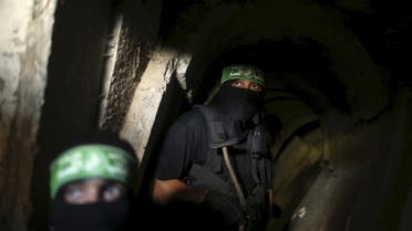 Palestinian fighters from the Izz el-Deen al-Qassam Brigades, the armed wing of the Hamas movement, are seen inside an underground tunnel in Gaza in this August 18, 2014 file photo. REUTERS