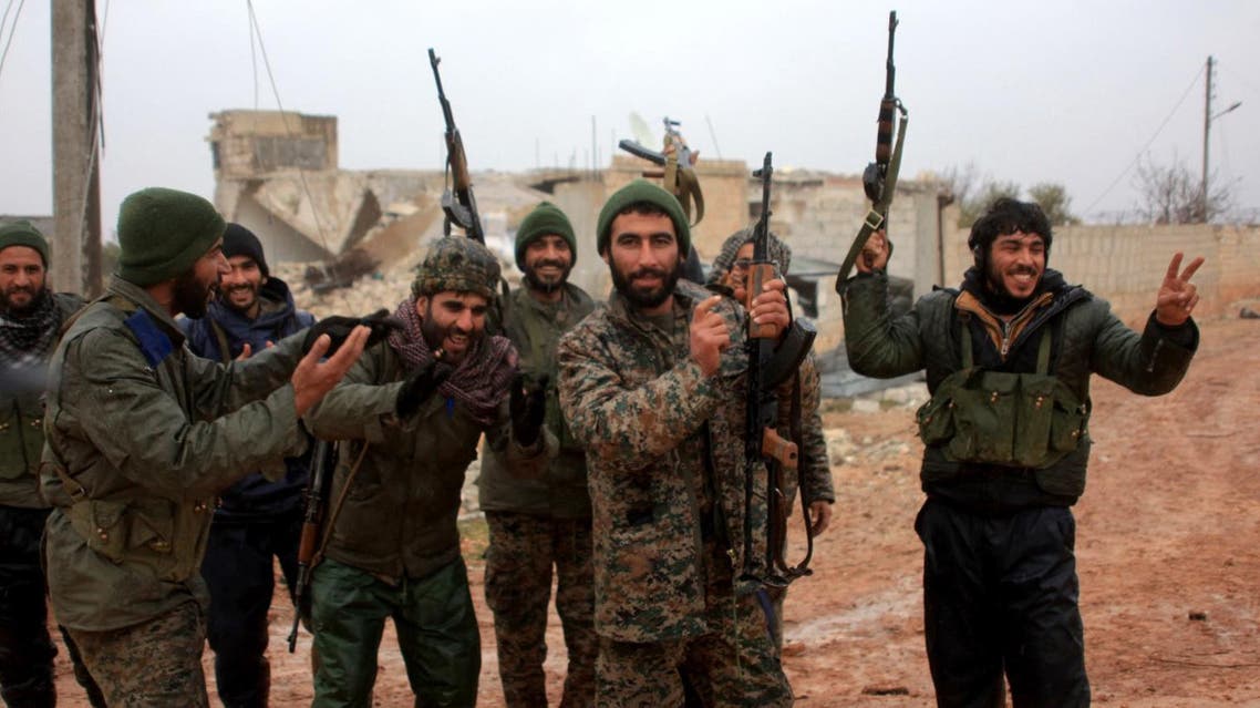 Ratian, Syria : Syrian government soldiers celebrate after taking control of the village of Ratian, north of the embattled city of Aleppo, from rebel fighters on February 6, 2016. Thousands of Syrians fled towards Turkey as regime troops pressed a major Russian-backed offensive around Aleppo, that threatens a fresh humanitarian disaster.