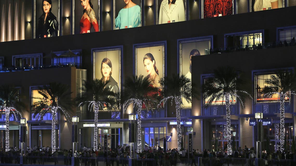 Tourists and visitor enjoy walking at the open space of Dubai Mall by the fountain in Dubai, United Arab Emirates, Monday, April 13, 2015. (AP)