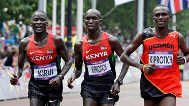 From left, silver-medallist Abel Kirui of Kenya, bronze-medallist Wilson Kipsang Kiprotich of Kenya, and gold-medallist Stephen Kiprotich of Uganda run during the men's marathon at the 2012 Summer Olympics in London. (AP)