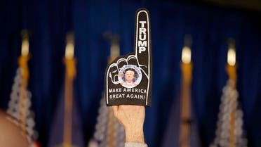 A supporter holds a foam finger sign promoting Republican presidential candidate businessman Donald Trump before he speaks at a primary night rally. (AP)