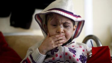 Five-year old Sheima, who lost both eyes when hit by a stray bullet in Syria, sits on her hospital bed in a small clinic near the Turkish-Syrian border in the southeastern city of Kilis. (Reuters)
