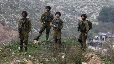Israeli security forces, pictured on January 14, 2016, are searching for the perpetrator who stabbed a Jewish man from the settlement of Neve Daniel. (AFP)