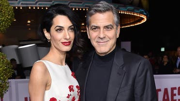 Amal Clooney, left, and George Clooney arrive at the world premiere of "Hail, Caesar!" at the Regency Village Theatre on Monday, Feb. 1, 2016, in Los Angeles. (AP)