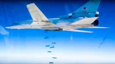 In this photo made from video footage provided by the Russian Defense Ministry on Wednesday, Dec. 9, 2015, a Russian Tu-22M3 bomber drops bombs on a target AP