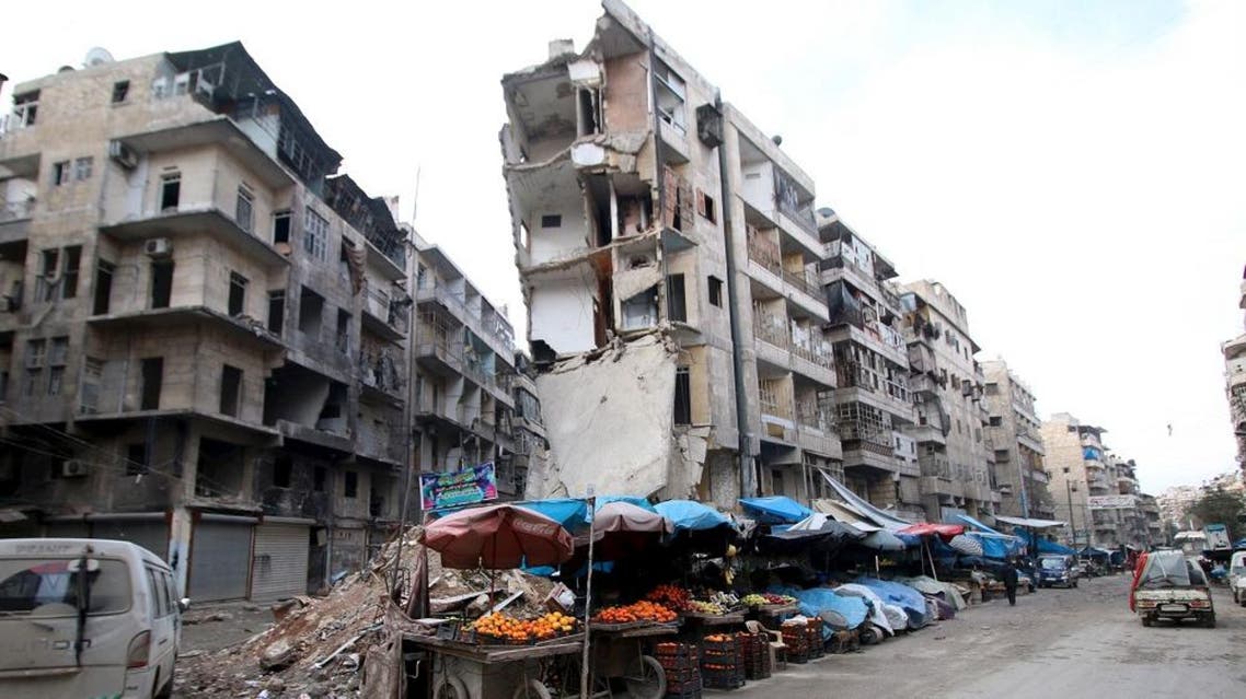 Stalls are seen on a street beside damaged buildings in the rebel held al-Shaar neighborhood of Aleppo, Syria, February 10, 2016 (Reuters)