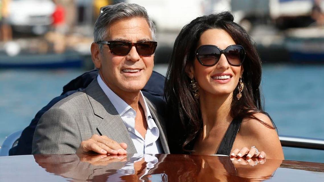 In this Sept. 26, 2014 file photo, George Clooney, left, and Amal Alamuddin arrive in Venice, Italy. Clooney, 53, and Alamuddin, 36, married in Venice, one of the world’s most romantic settings. (AP Photo/Luca Bruno, File)