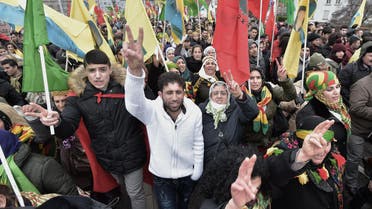 Members of the Kurdish community flash the v for victory sign on February 13, 2016, in Strasbourg, eastern France, during the annual rally of Kurds from all over Europe to denounce the detention of jailed leader of Turkey's Kurd rebels, Abdullah Ocalan. AFP