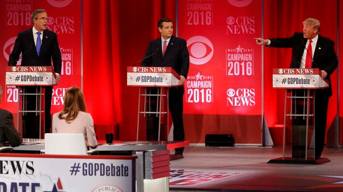 Republican U.S. presidential candidates former Governor Jeb Bush (L) and businessman Donald Trump (R) speak simultaneously about the war in Iraq and the record of Bush's brother, former President George W. Bush, as Senator Ted Cruz (C) looks on during the Republican U.S. presidential candidates debate sponsored by CBS News and the Republican National Committee in Greenville, South Carolina February 13, 2016 (Reuters)