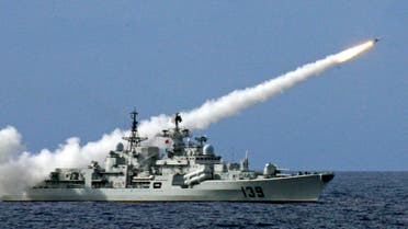 In this July 26, 2010, file photo rleased by China's Xinhua News Agency on July 29, 2010, a warship launches a missile during a live-ammunition military drill held by the South China Sea Fleet of the People's Liberation Army (PLA) Navy in the South China Sea. 