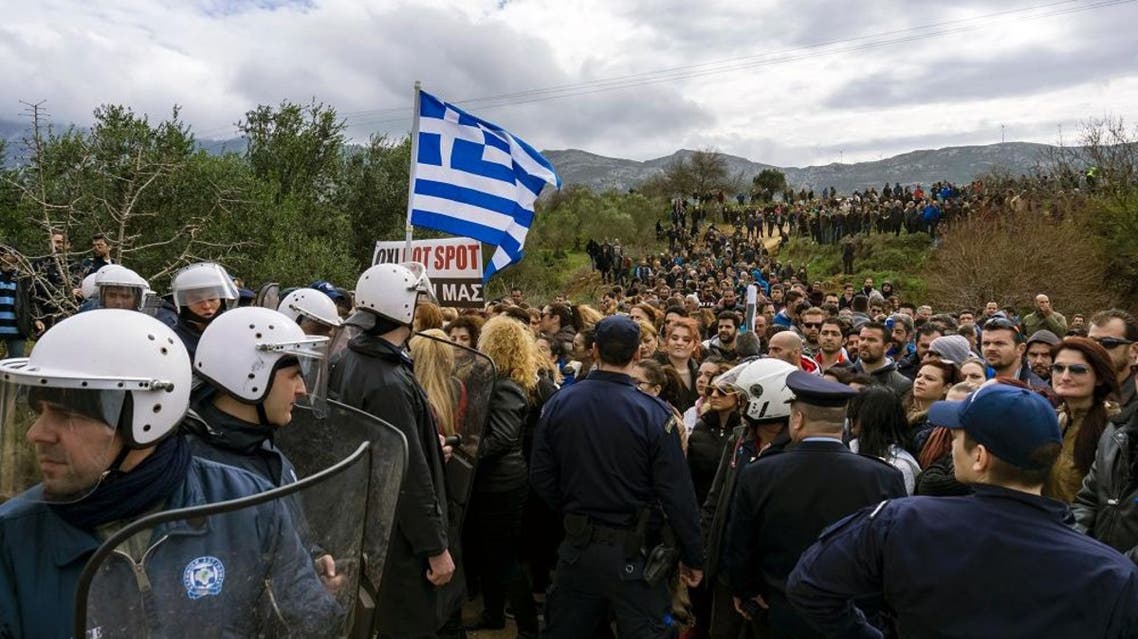 People protest against the so-called "hotspot" being built for refugees and migrants on the Aegean island of Kos, on February 14, 2015 (AFP)