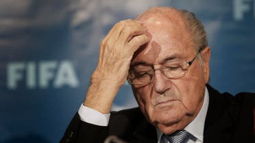  FILE - In this Dec. 19, 2014 file photo FIFA President Sepp Blatter gestures as he attends a news conference in Marrakech, Morocco. The FBI is investigating Blatter's role in a kickbacks scandal that involved his predecessor as FIFA president, Joao Havelange, the BBC reported Sunday, Dec. 6, 2015. (AP Photo/Christophe Ena, File)