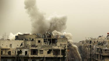 Smoke rises after a shell fell on a building that forces loyal to Syria's president Bashar Al-Assad are located in, after being fired from rebel fighters in the Seif El Dawla neighbourhood in Aleppo March 28, 2015. (Reuters)